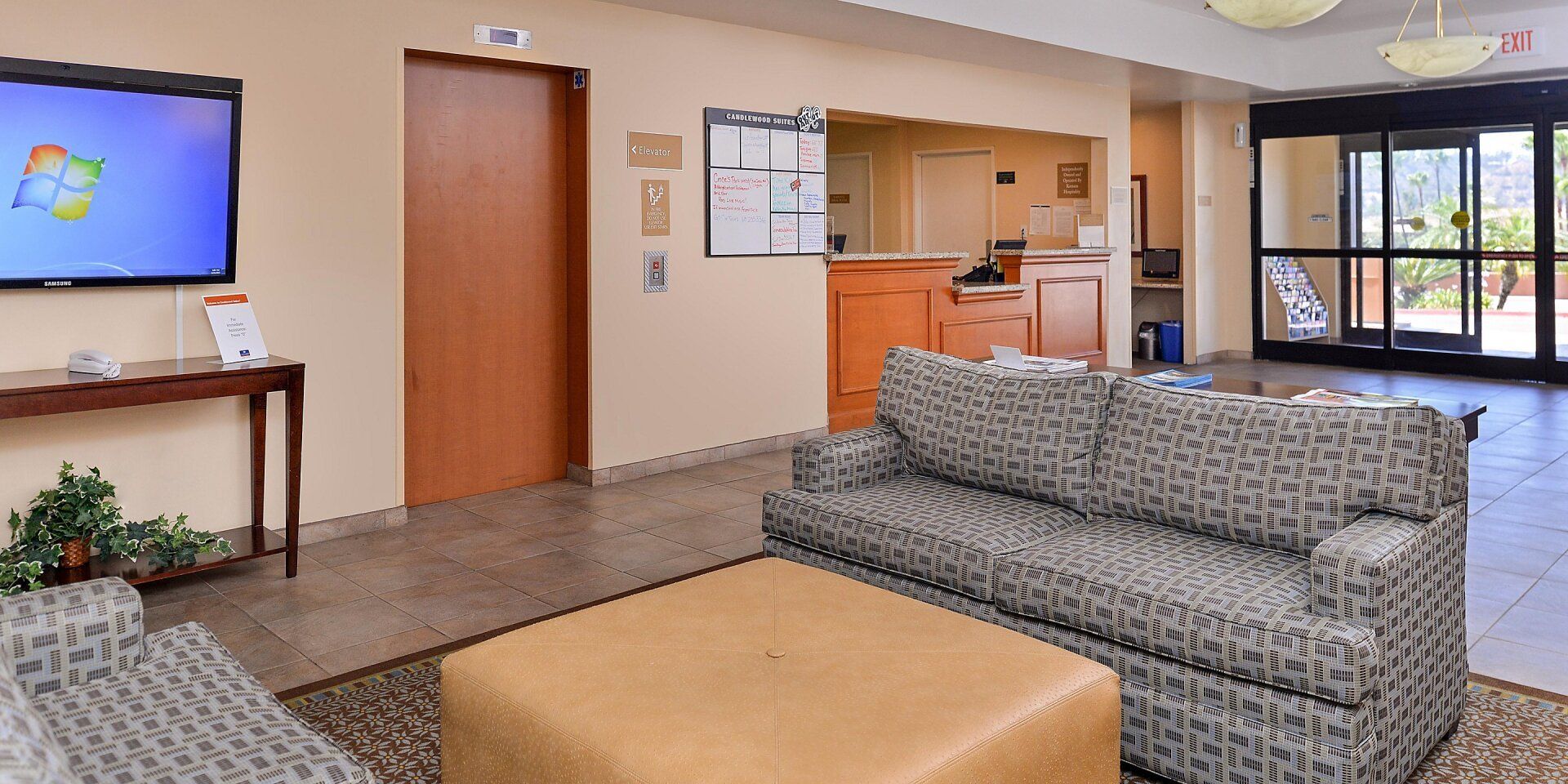 view of the hotel lobby with two grey couches