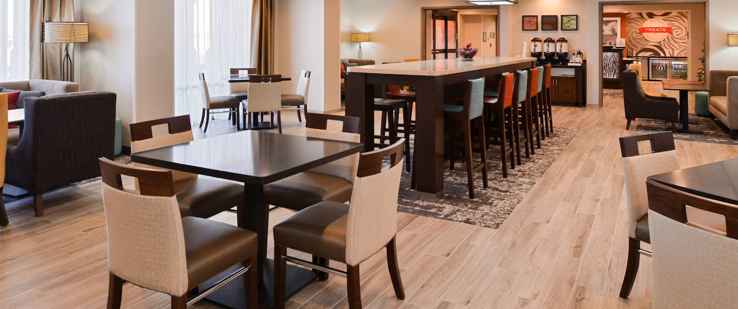 view to the hotels breakfast room with a large table and multiple chairs