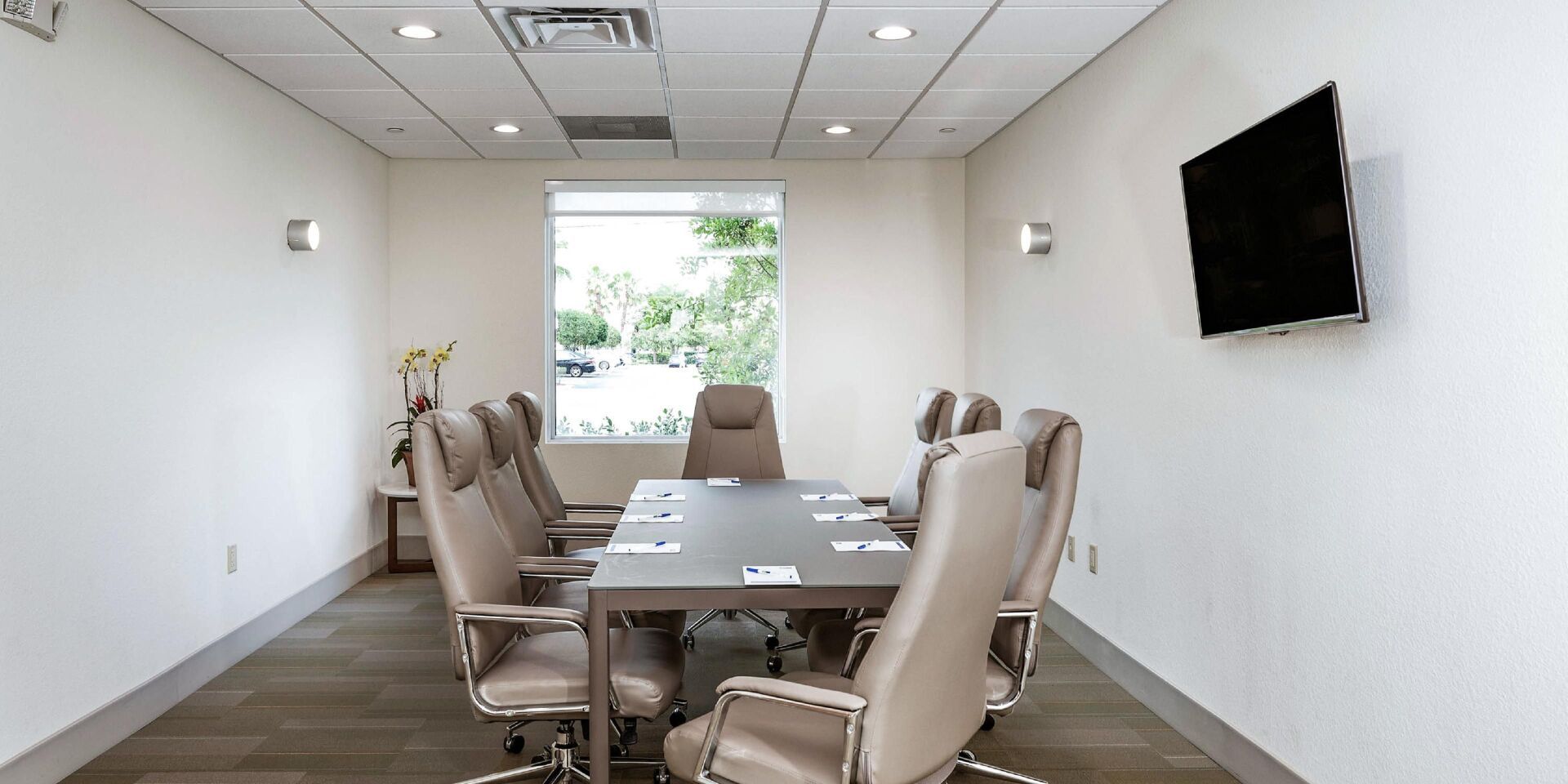 office chairs surrounding large table in the hotel business room