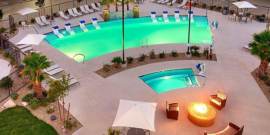 high view of the large outdoor pool and jacuzzi