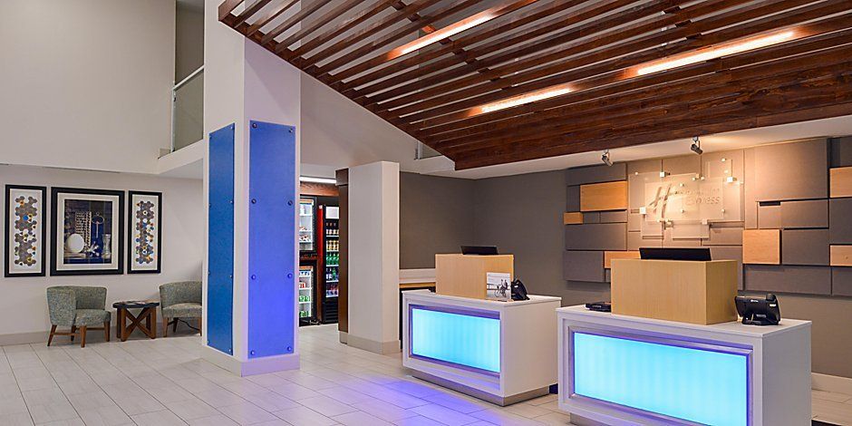 view of the hotel lobby and check in area with blue lights