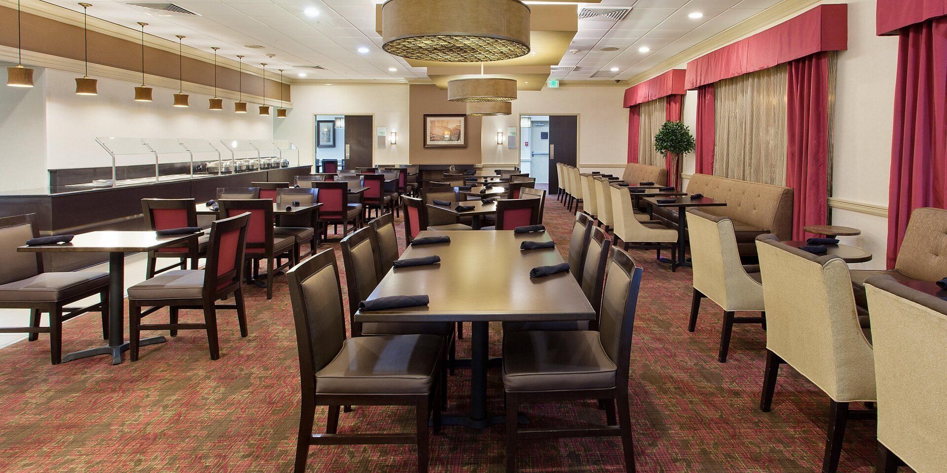 view to the hotel Buffett room with large tables and chairs