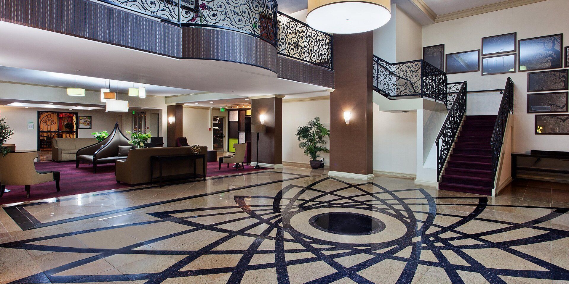 view of the hotel lobby with with stairs leading to the second floor