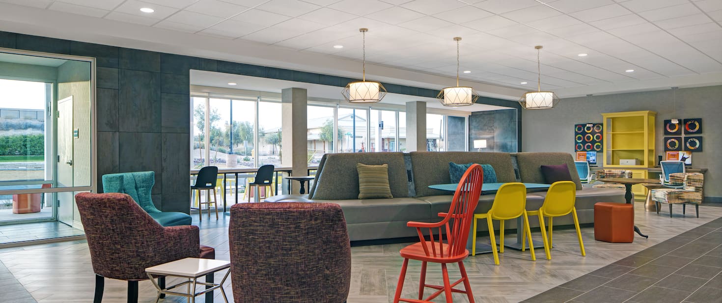 view of the hotel lobby with multiple chairs and a large couch area