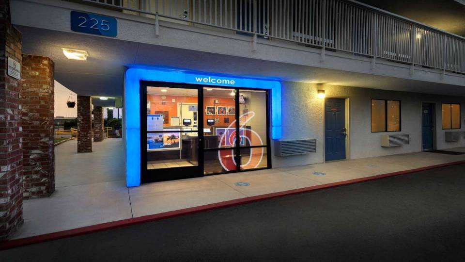 Blue lights outside entrance doors of Motel 6 Arcadia, CA - Los Angeles - Pasadena Area