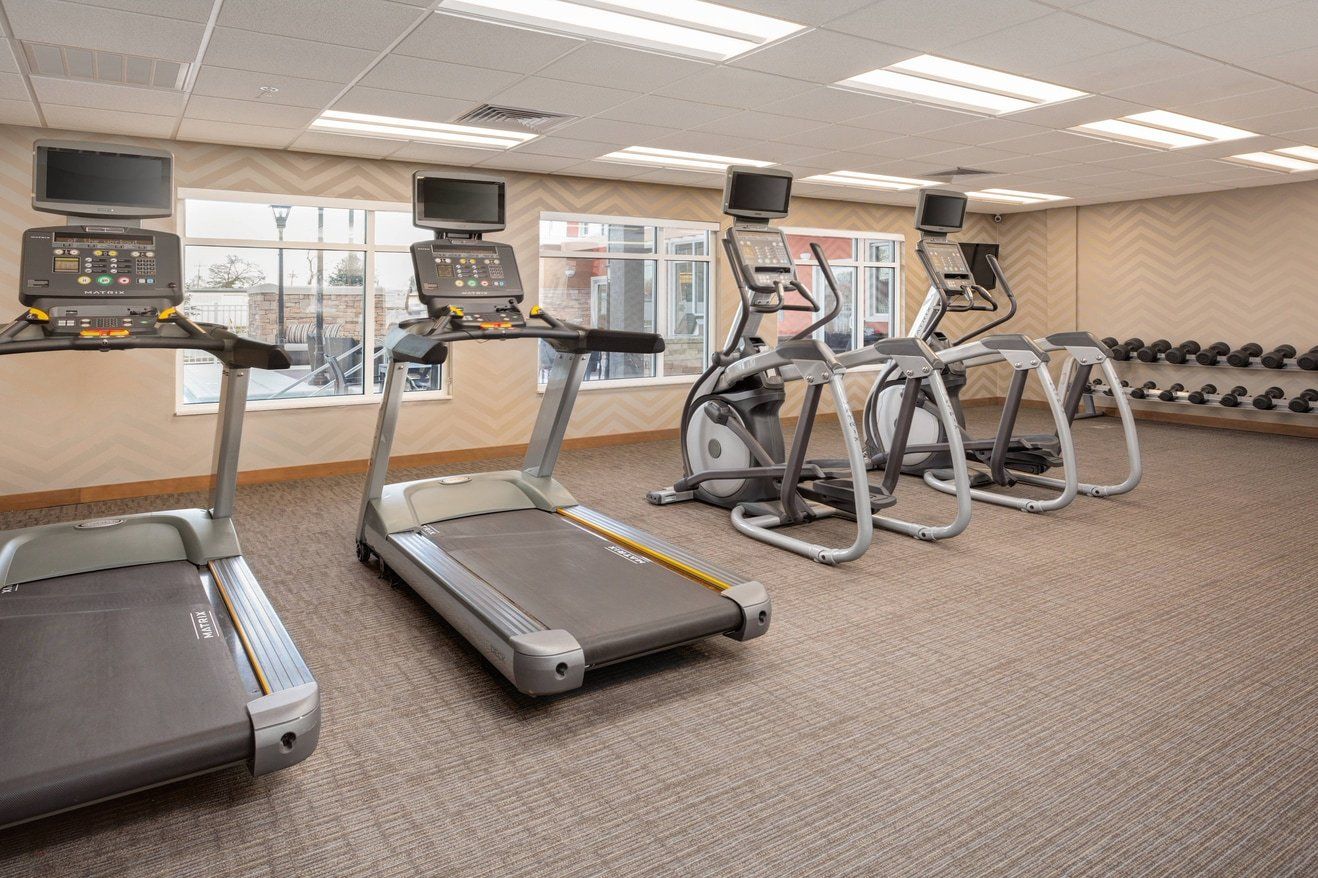 view to the hotel fitness room with multiple cardio machines