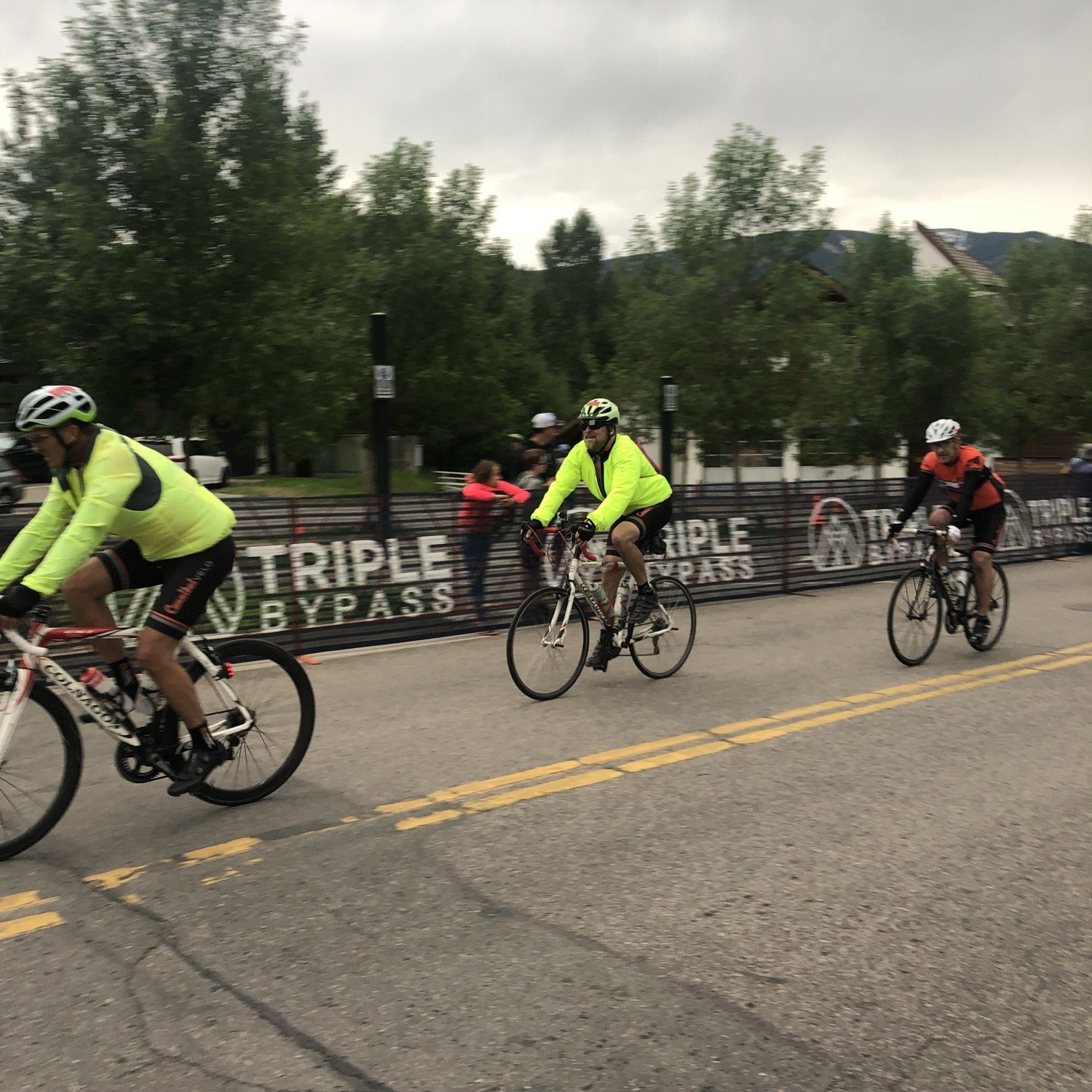 Dick Rees and friends crossing finish line.