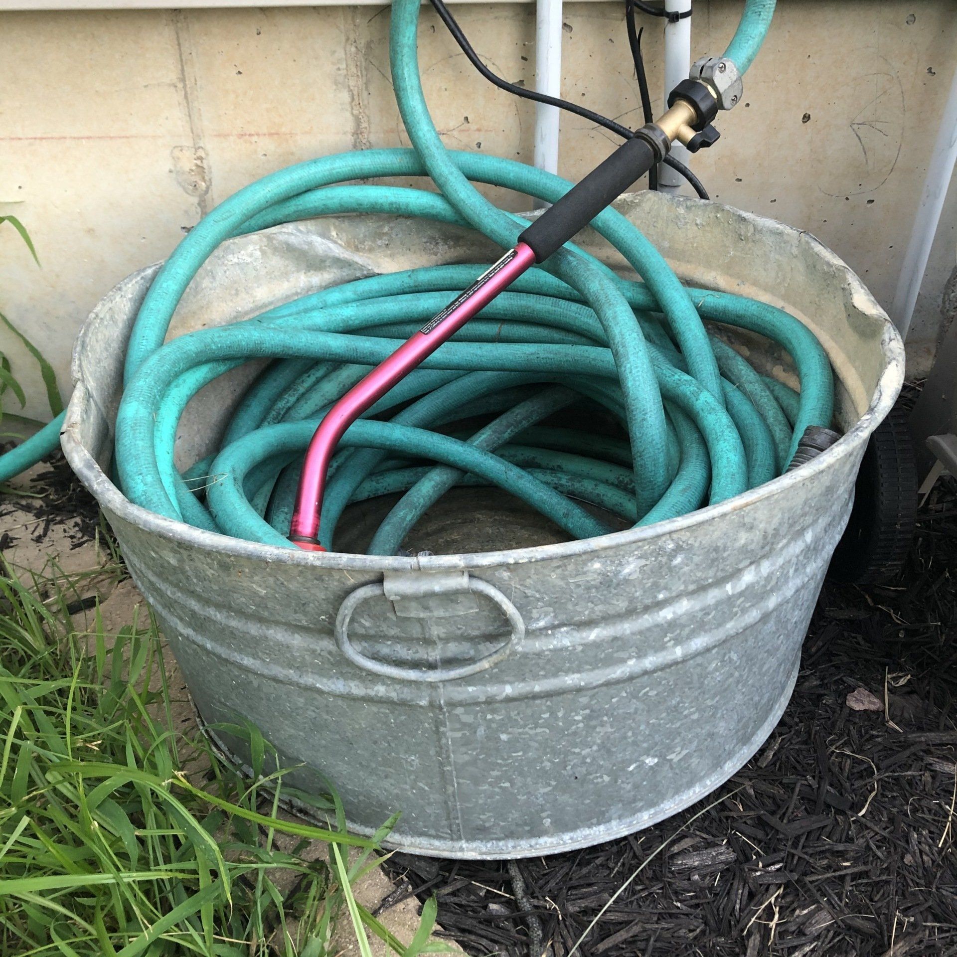 washtub with garden hose