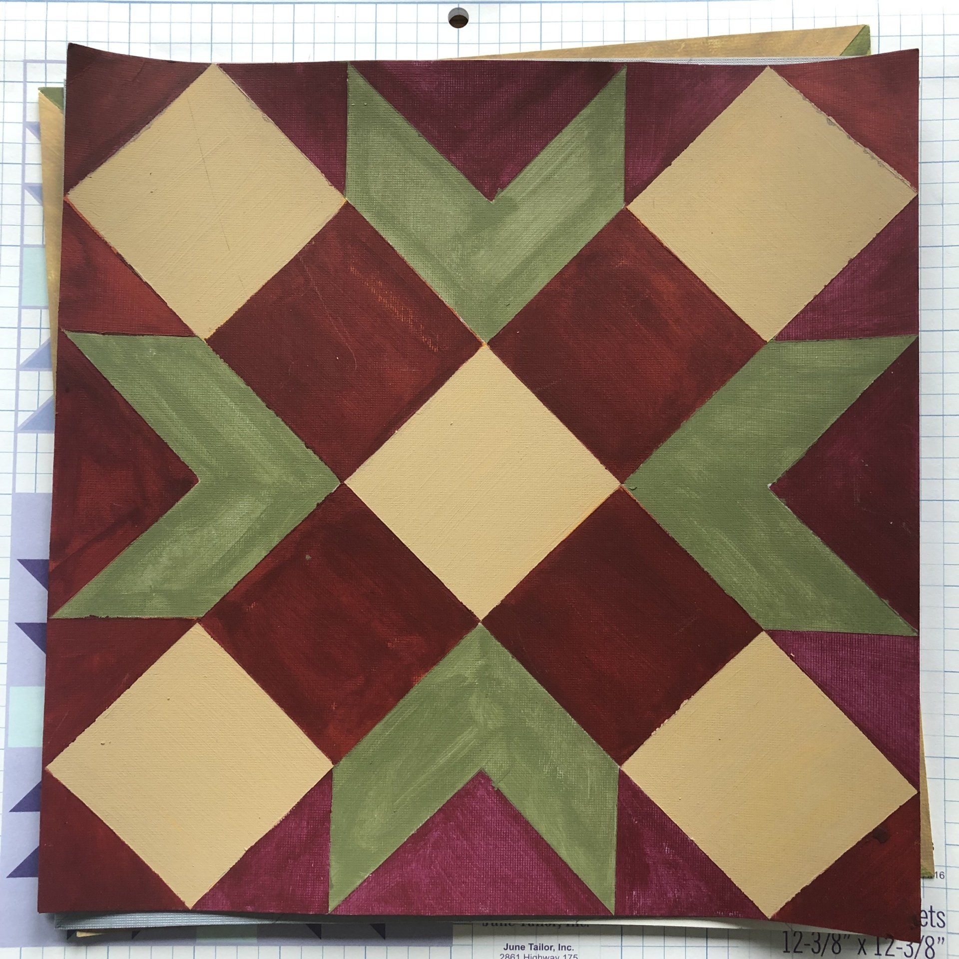 A painted rendering of a barn quilt design.