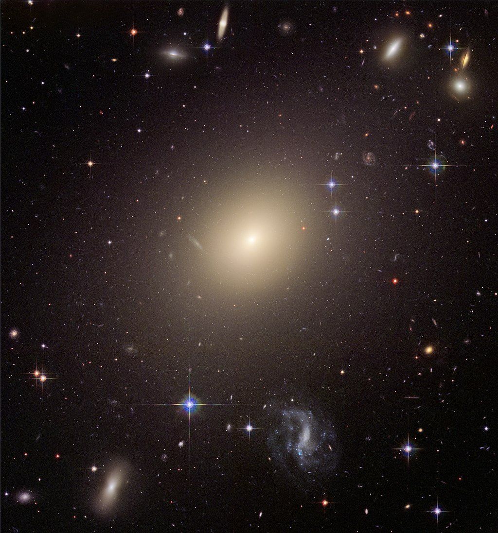 Photograph of an eliptical galaxy in the distance