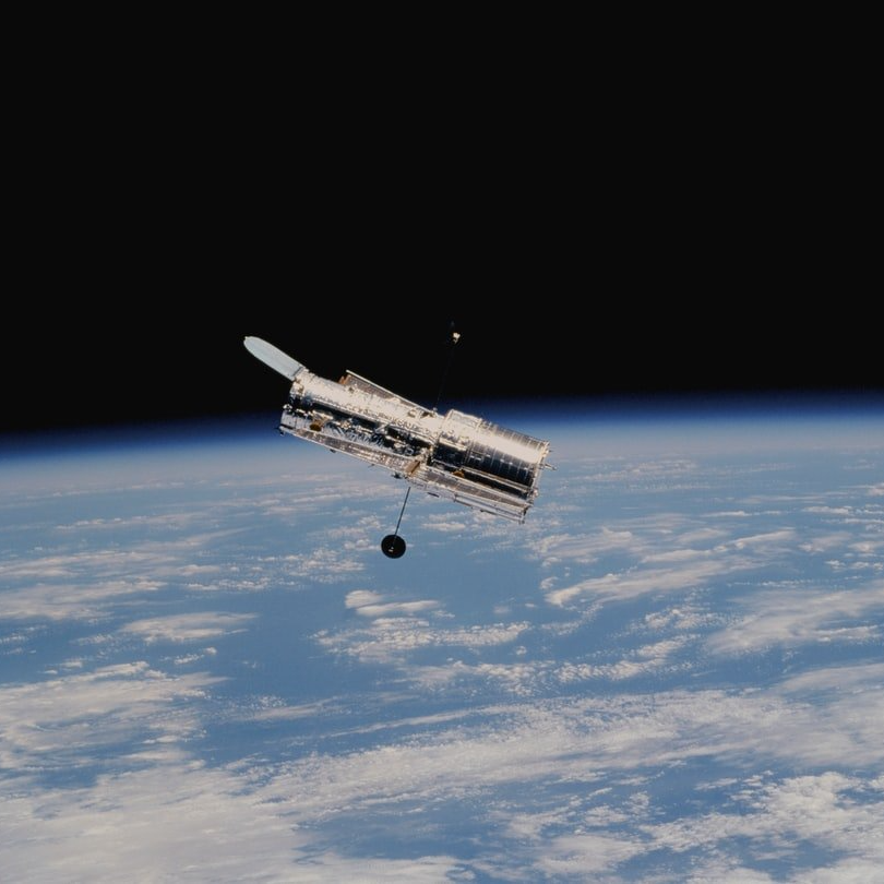 Photograph of a satellite orbiting earth