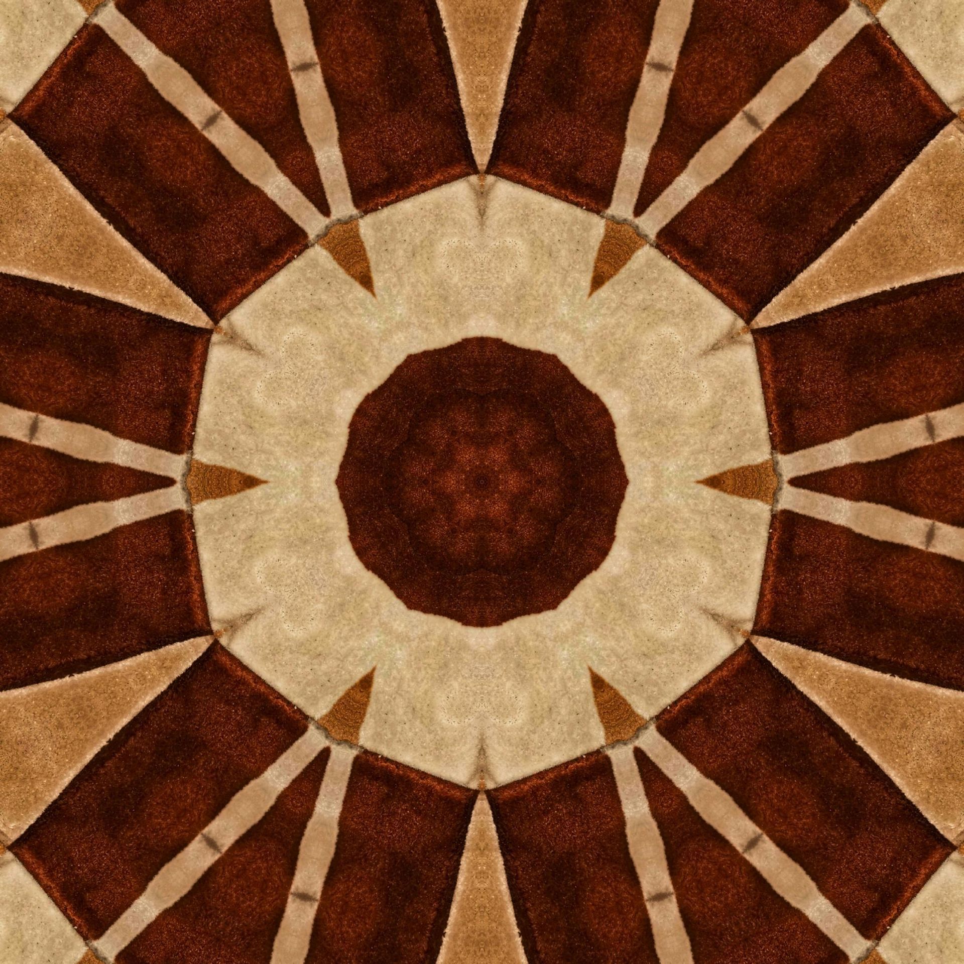 Kaleidoscope pattern of brown and beige brickwork.