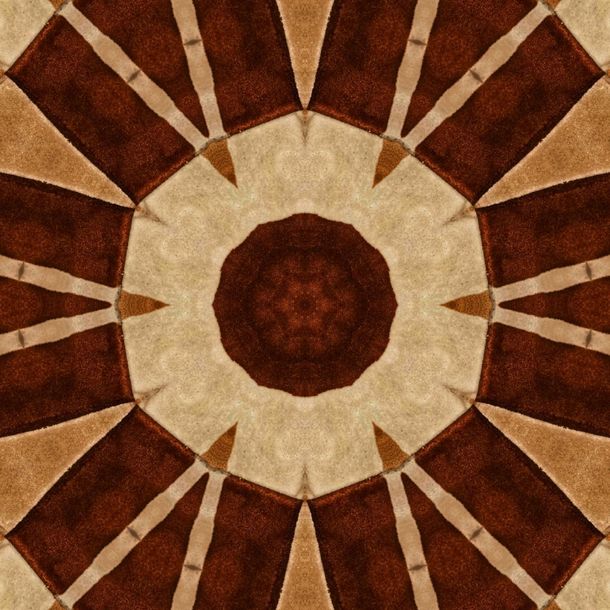 Brown and tan kaleidoscope pattern; central dark brown circle, surrounded by lighter shapes.