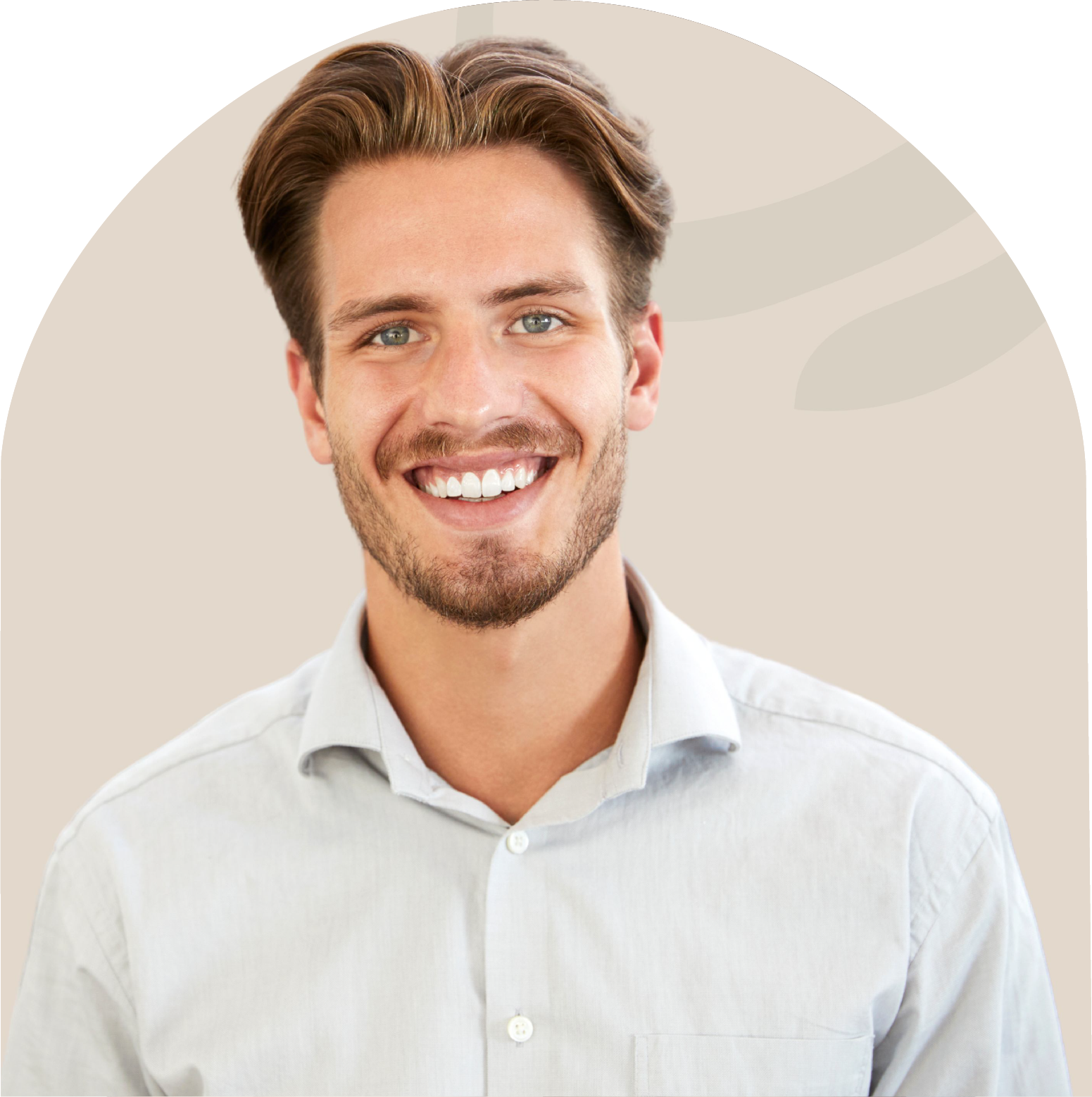 A man with a beard is smiling for the camera while wearing a white shirt.