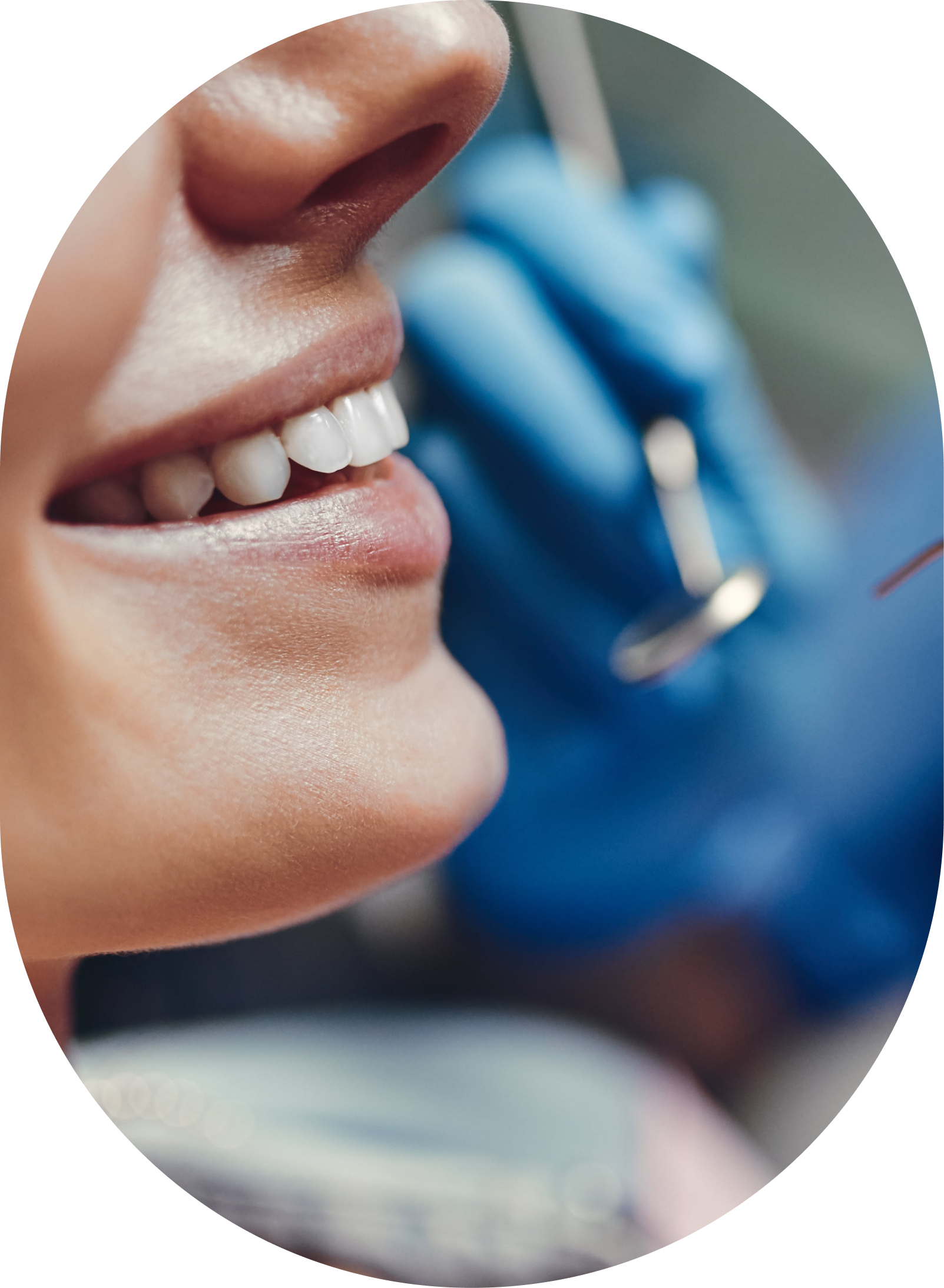 A woman is getting her teeth examined by a dentist.