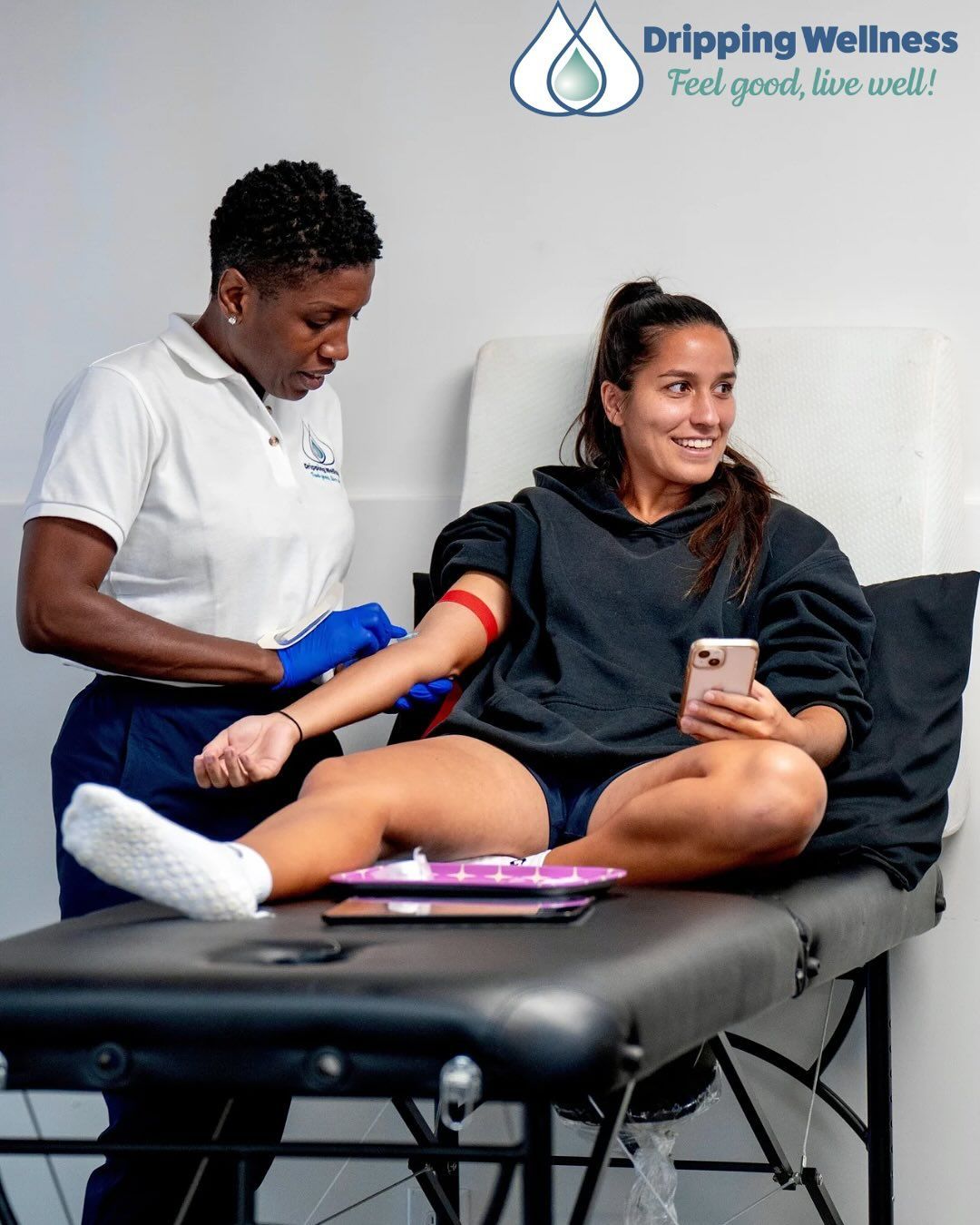Woman having blood drawn at a wellness clinic.