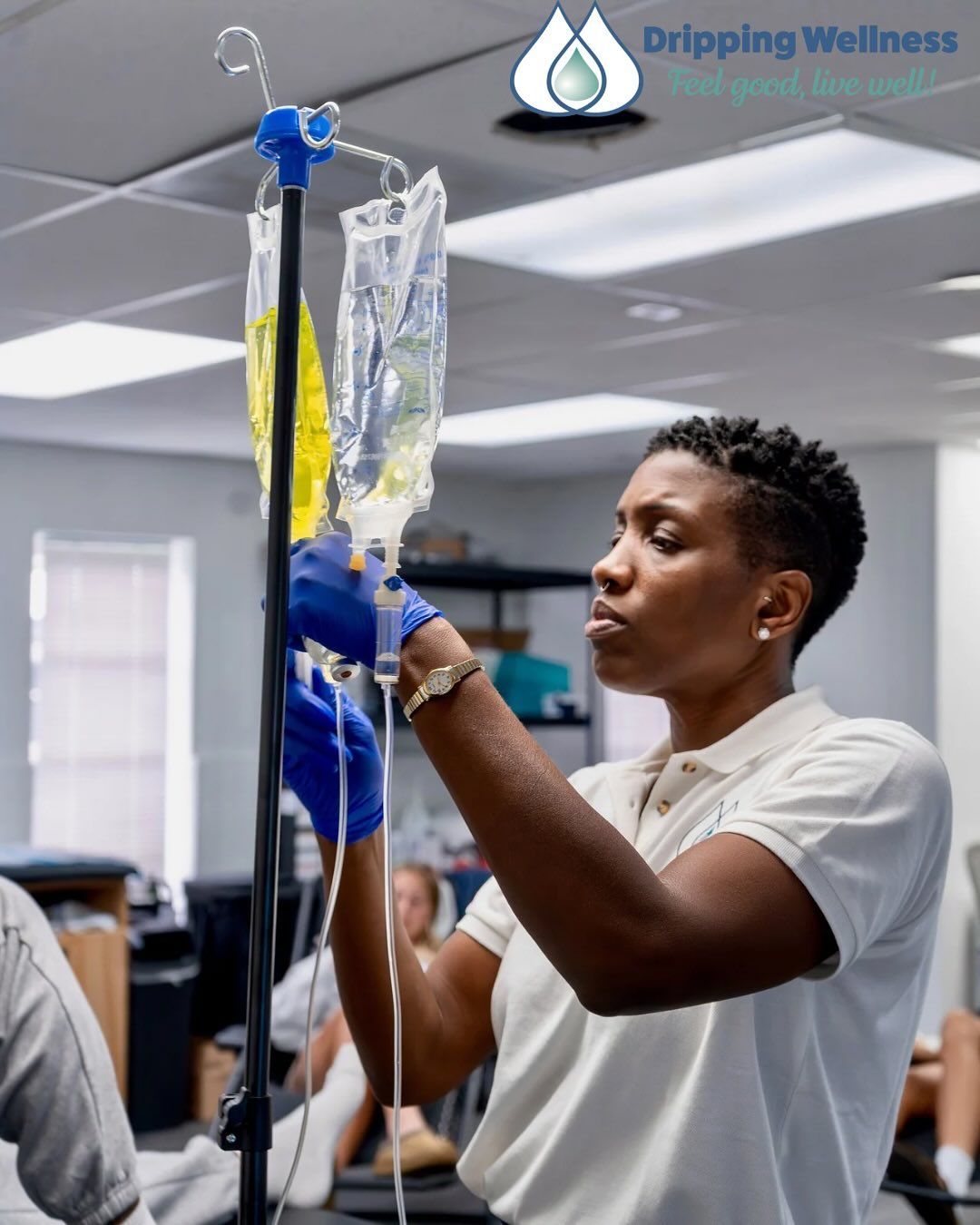CEO Faith Stample, LPN preparing IV drip bags in a clinic setting.