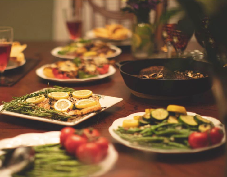 Woman in kitchen holding