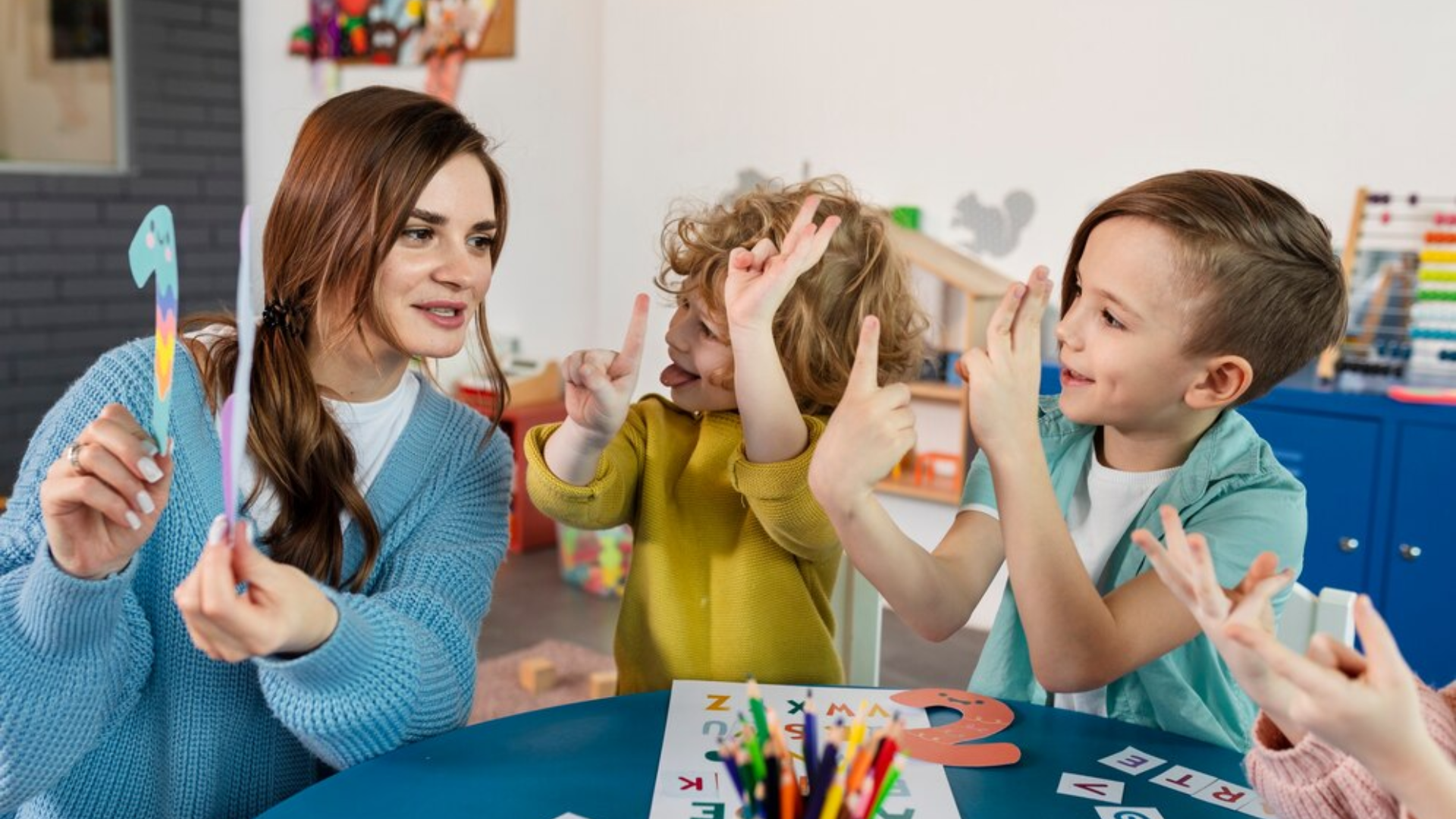 A woman is teaching a group of children how to sign.
