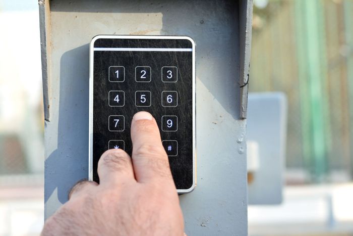 Person Hand Pressing Password - Cookeville, TN - Stor-N-Lock Self Storage