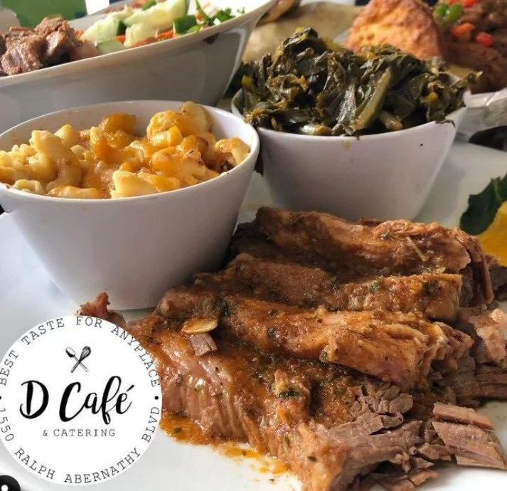 A tray of food with a d cafe logo in the corner