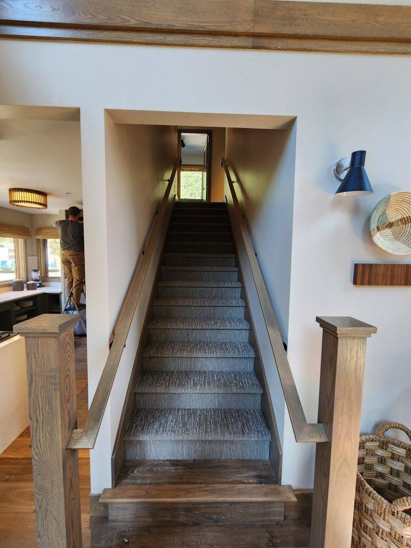 A set of stairs leading up to the second floor of a house.
