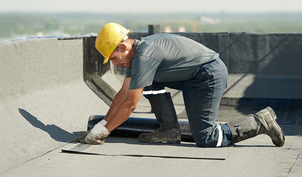 man repairing commercial roof