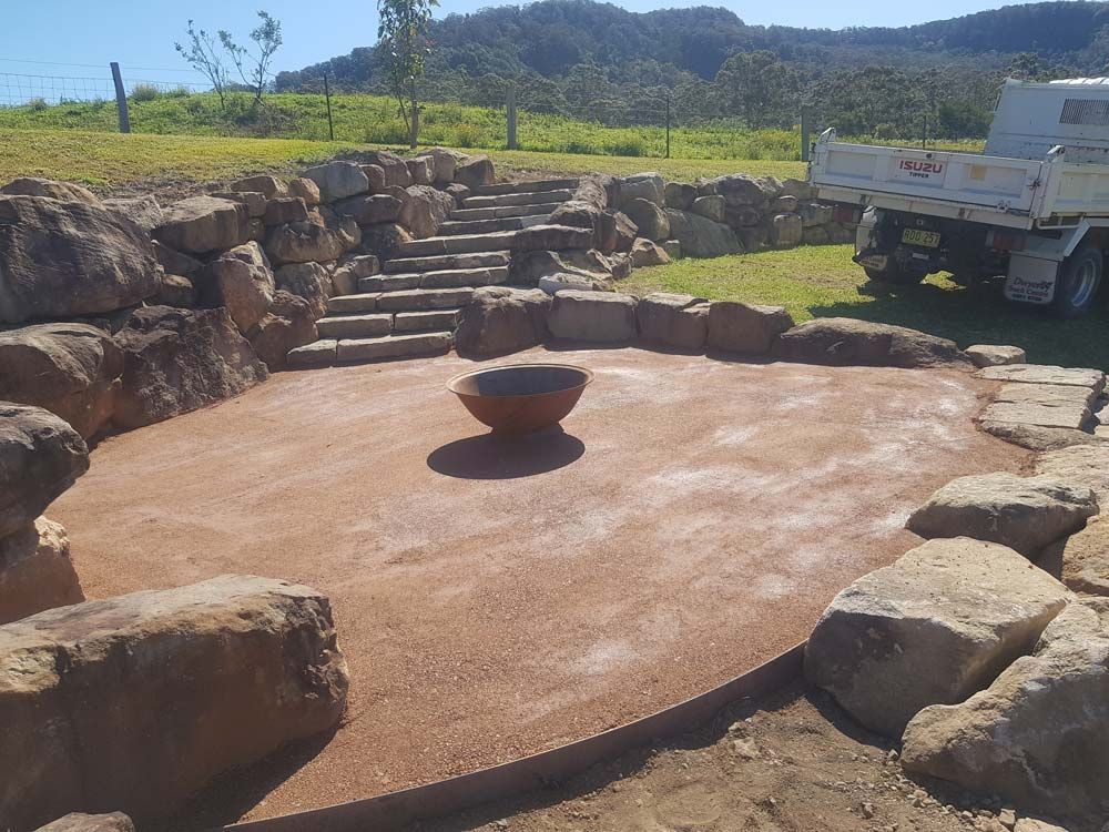 Bonfire Pit at the Center of Rock Landscape — Wallaroo Landscapes In Nowra, NSW