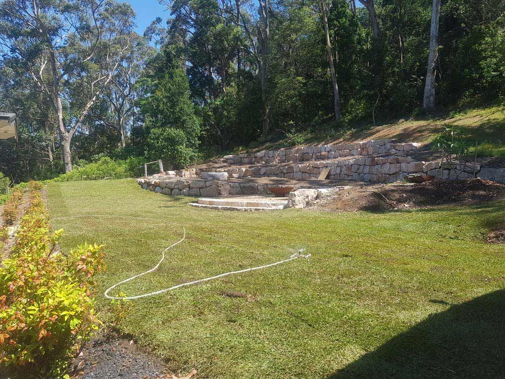 Rock Wall and Lawn — Wallaroo Landscapes In Nowra, NSW