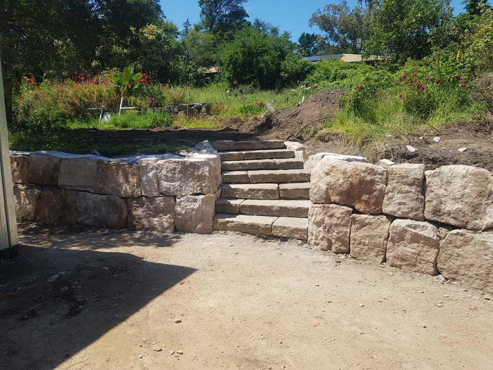 Front View Rock wall and Stairs — Wallaroo Landscapes In Nowra, NSW