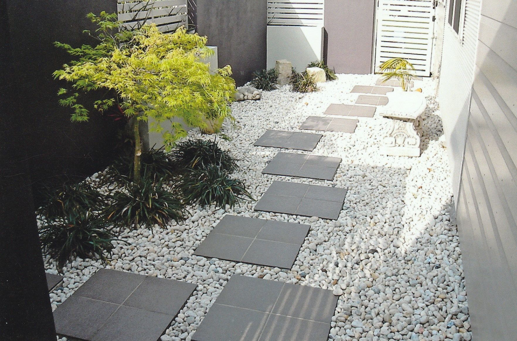 Black Stones Garden Path On White Pebbles And Lush Green Trees — Wallaroo Landscapes In Nowra NSW