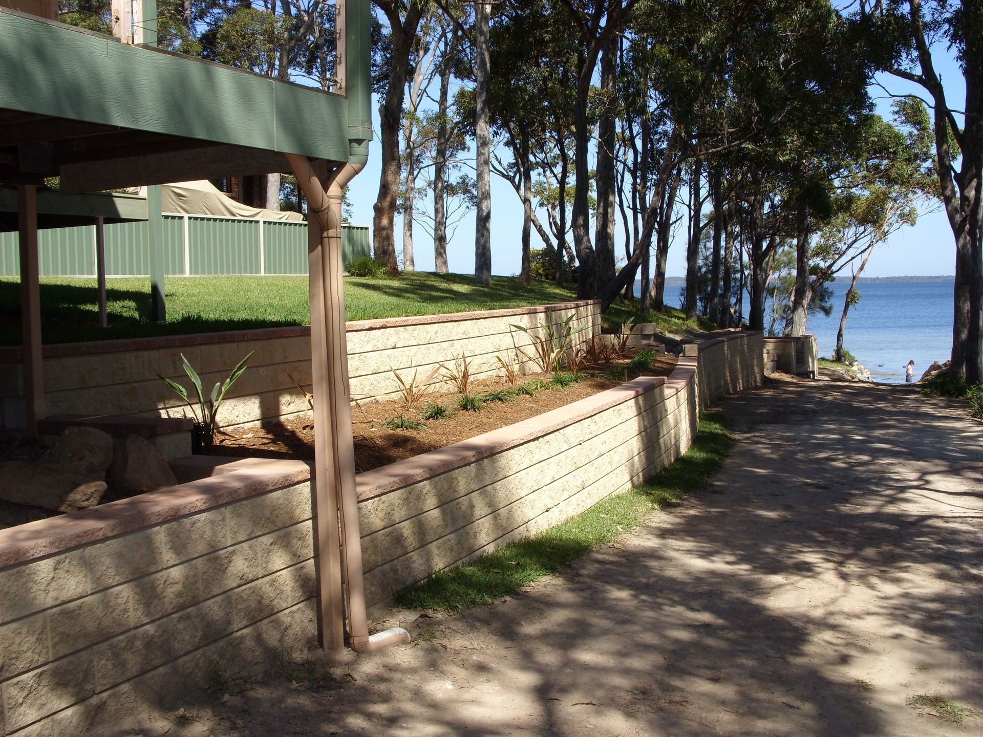 Retaining Wall With Steps Leading Into Existing Landscaped Garden — Wallaroo Landscapes In Nowra NSW