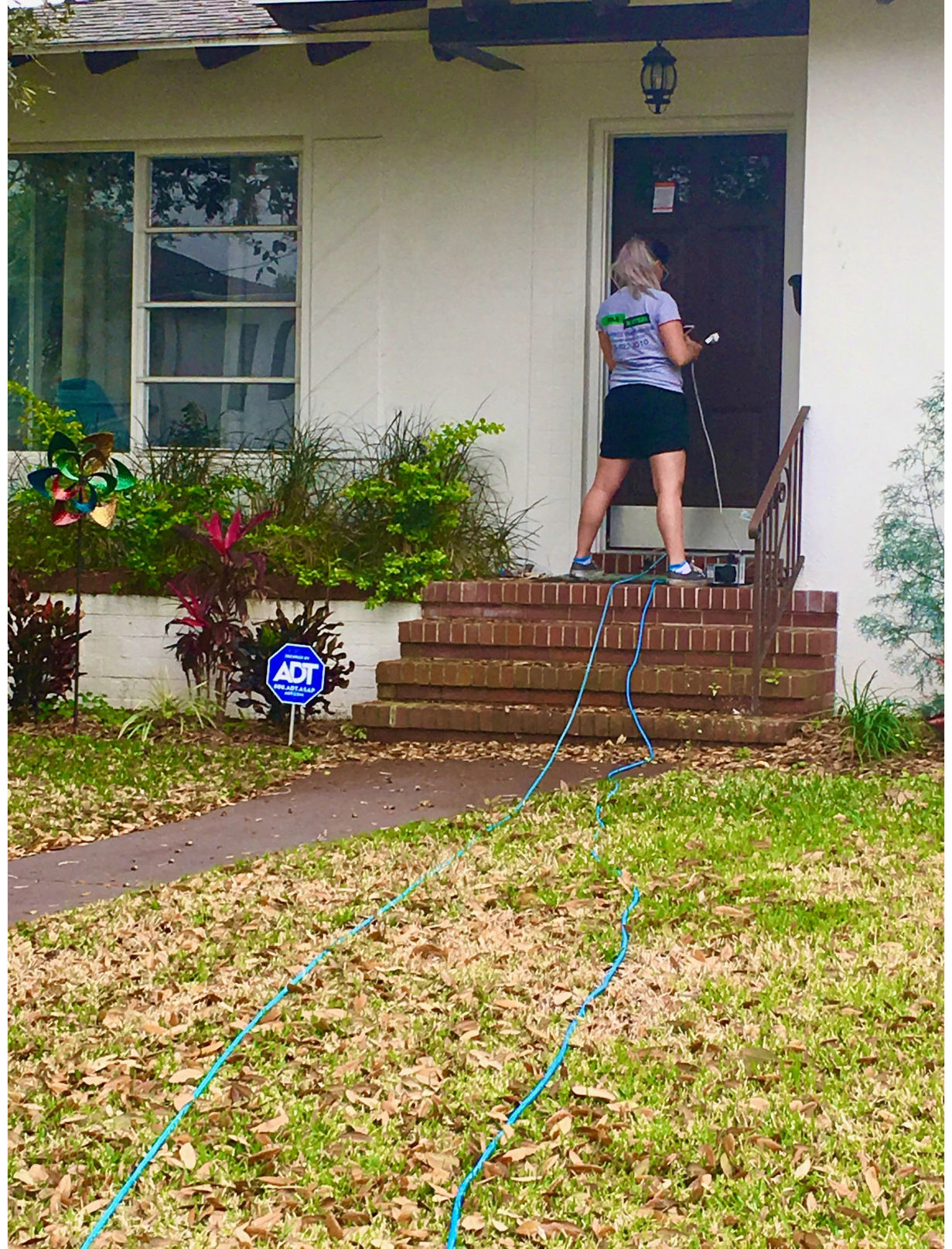 a woman is air quality testing a home