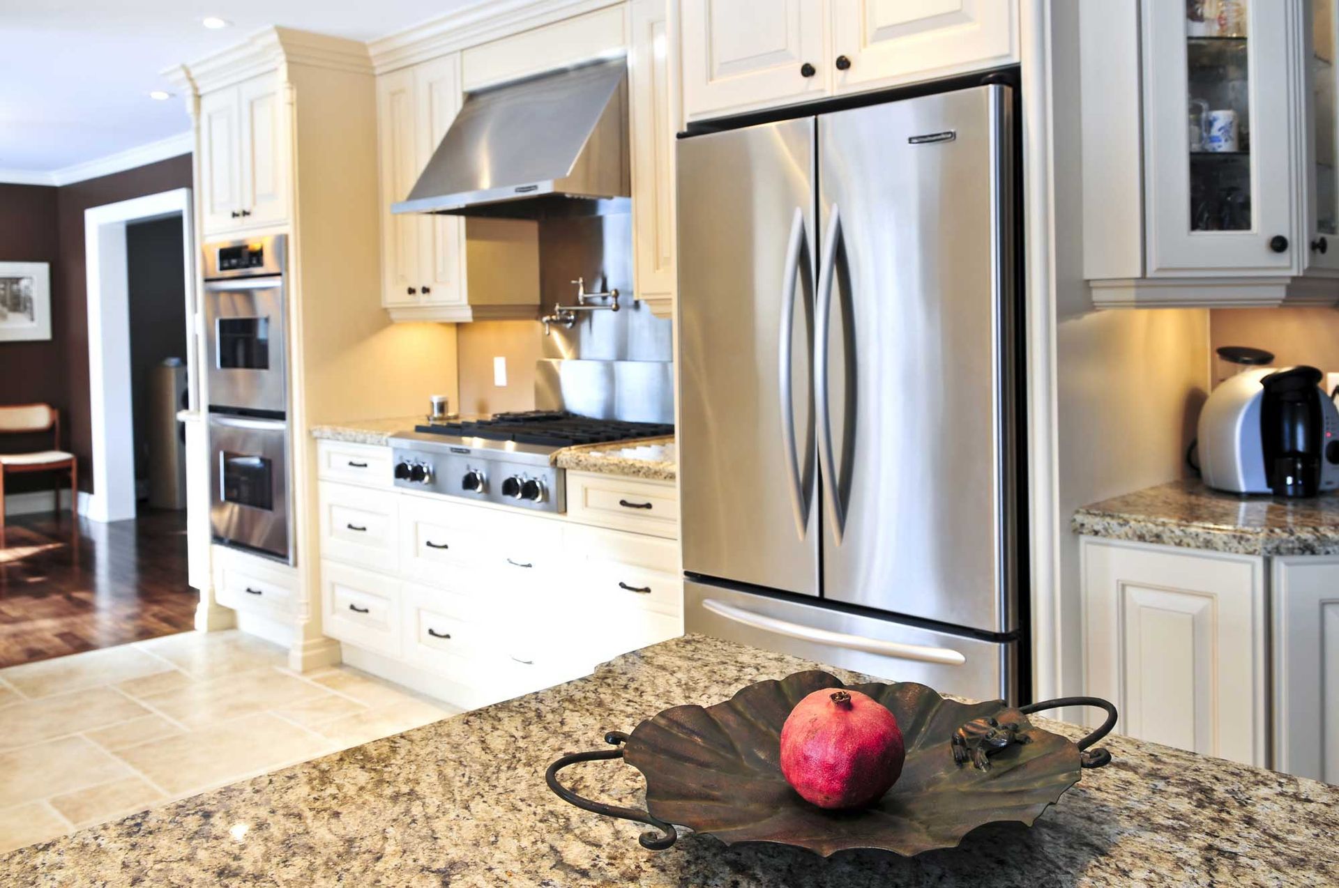 A kitchen with stainless steel appliances and granite counter tops