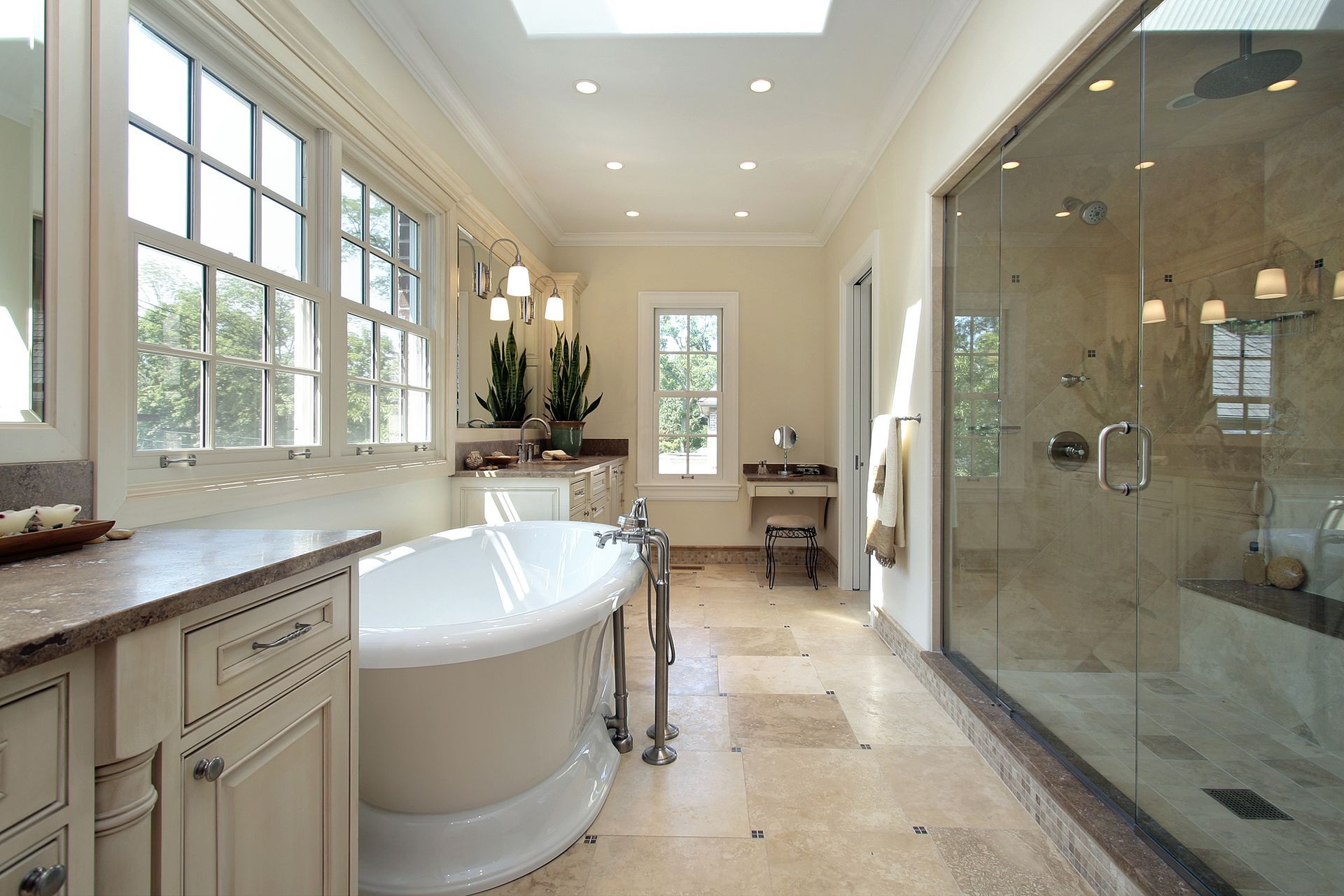 A bathroom with a tub and a walk in shower