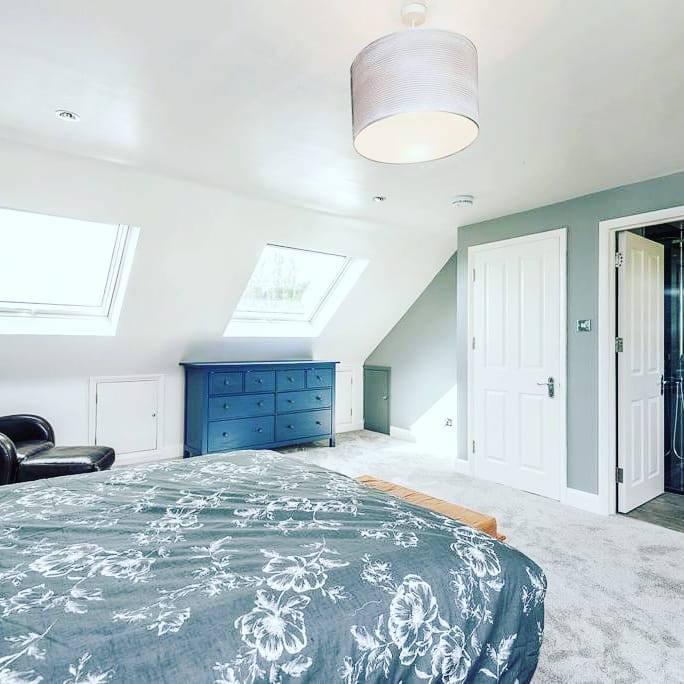 bed and drawer in loft room