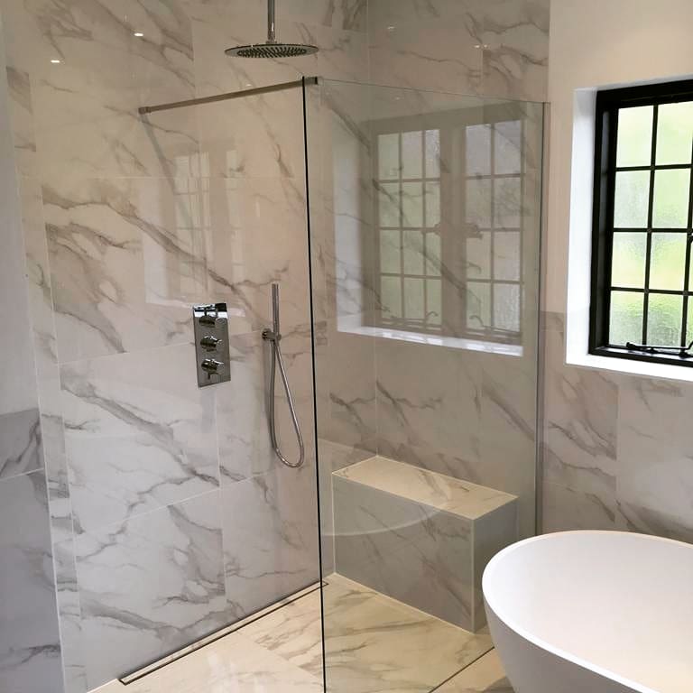 bathroom with shower and glass door