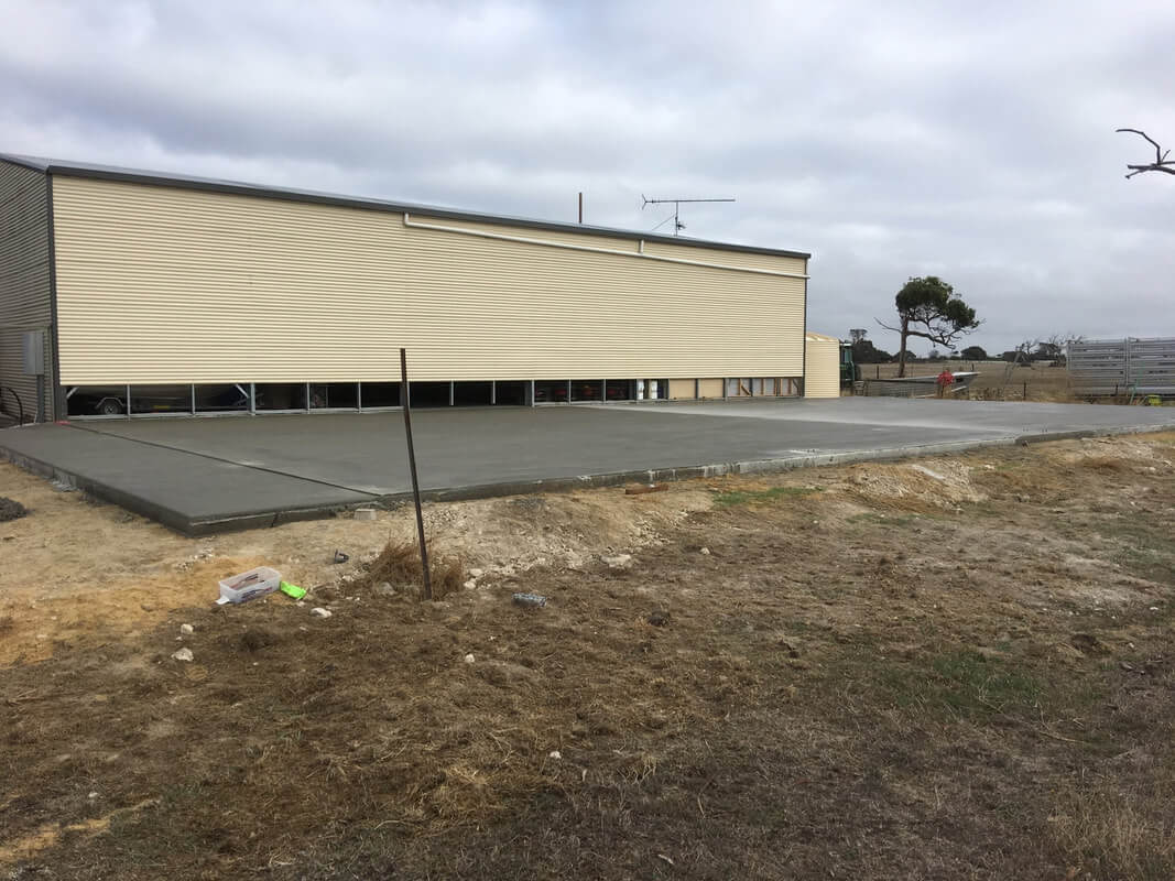 Parham Sheds - 25mpa/150mm/f82 concrete slab including aprons ready for this rural machinery/boat shed