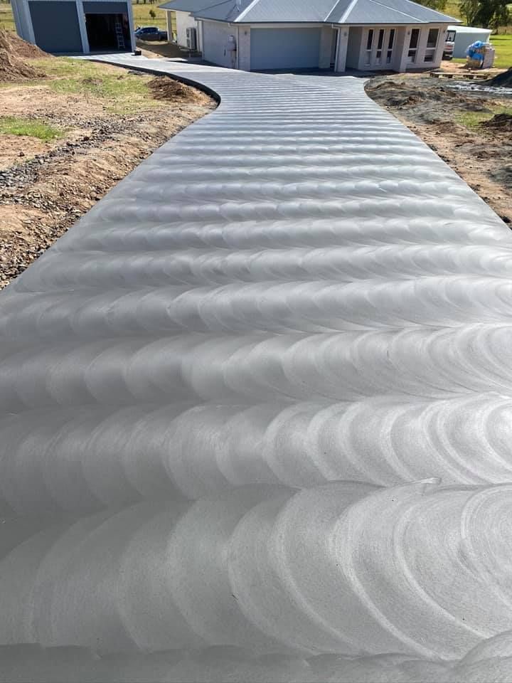 Newly Paved Driveway With Textured Circular Patterns — Wal's Concreting Service in North Casino, NSW