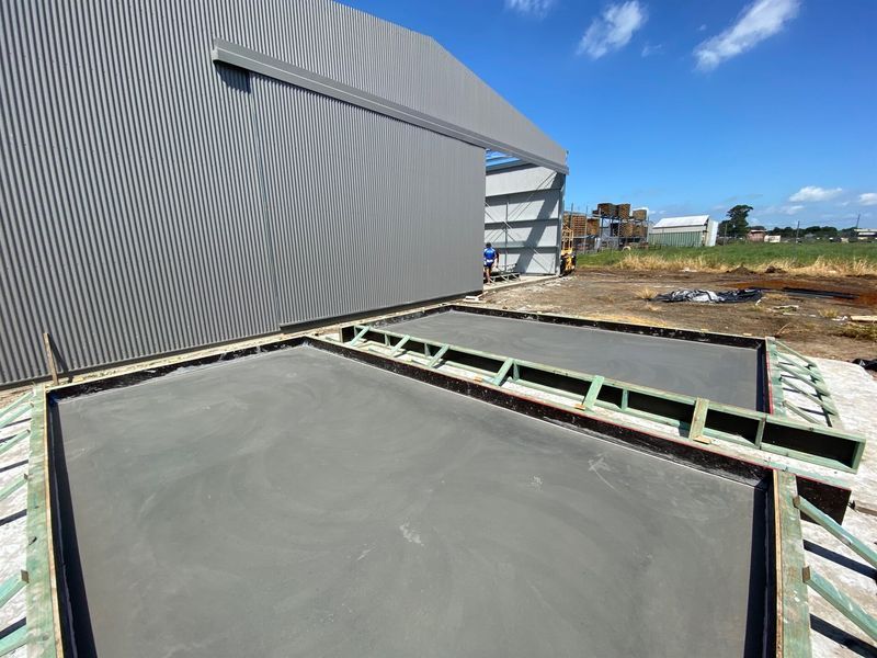 A large timber frame with concrete slab in front — Wal's Concreting Service in Ballina, NSW