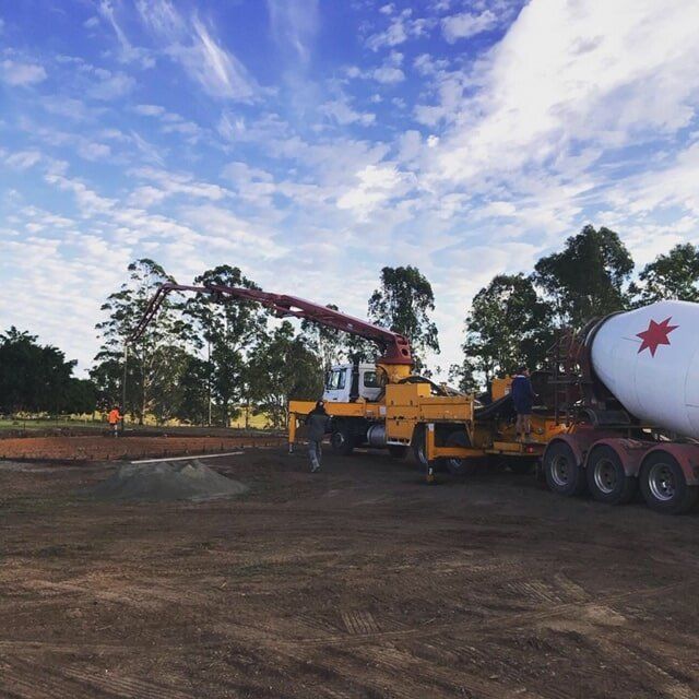 Concrete Truck Pouring Concrete at a Construction Site on a Sunny Day — Wal's Concreting Service in North Casino, NSW