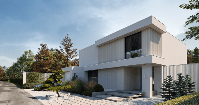 A white house with a fence and trees in front of it.