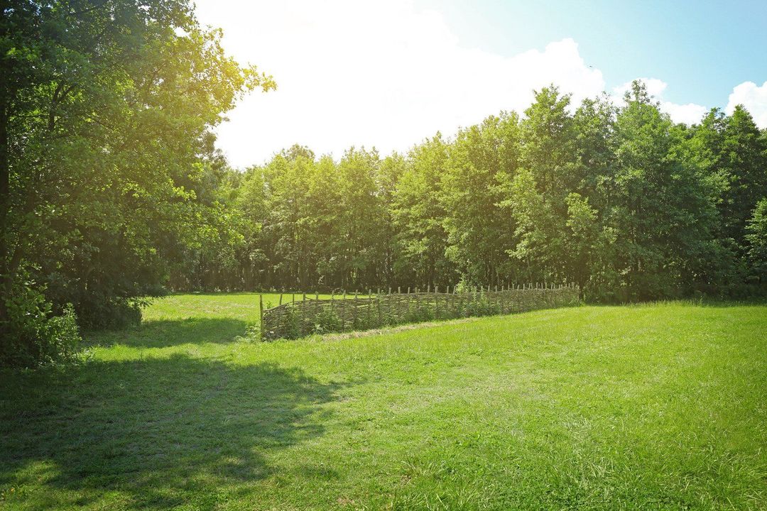 The inside of a moving truck filled with boxes and blankets.