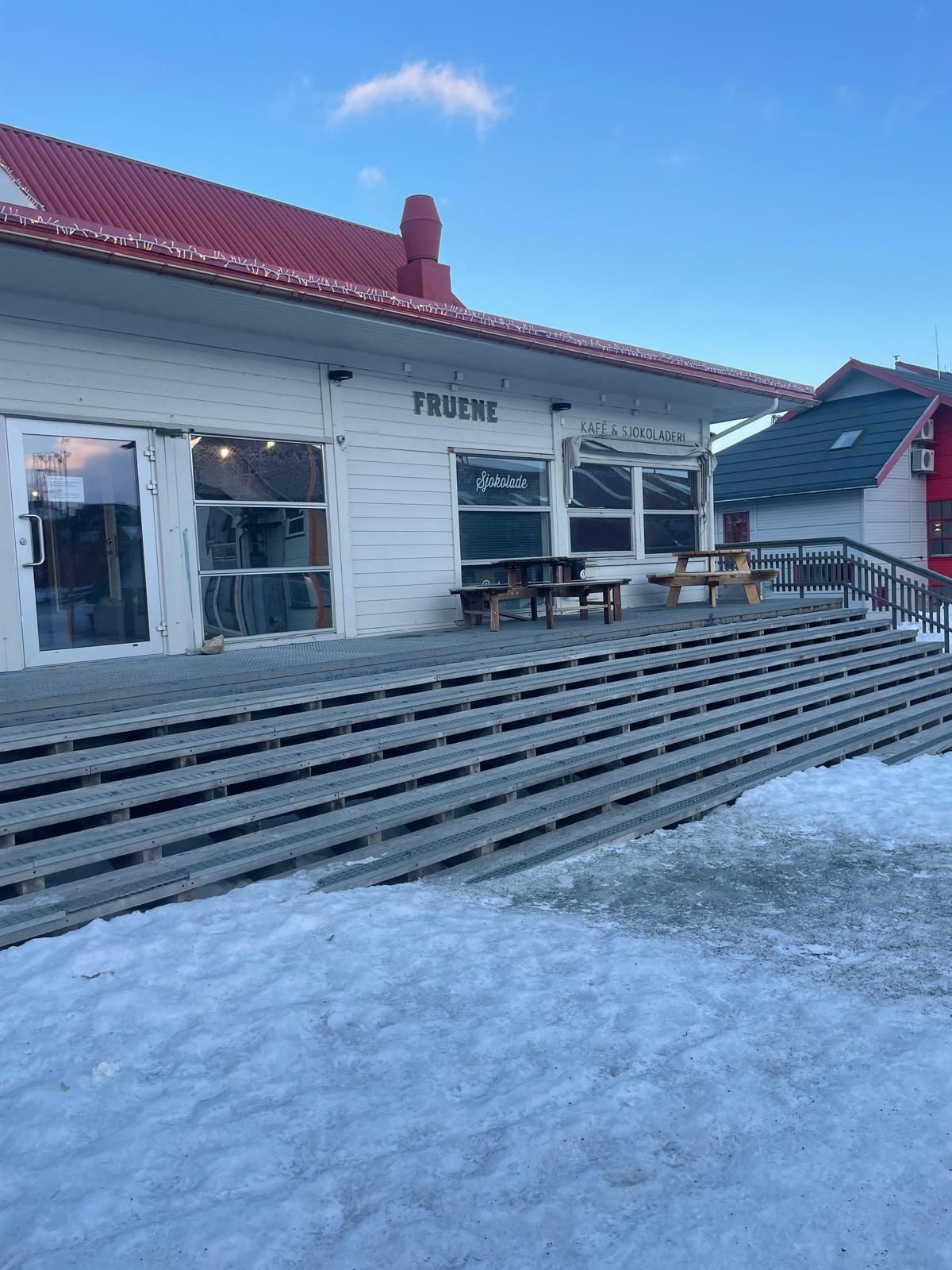 A variety of desserts are displayed in a glass case.