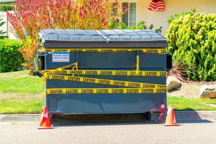 dumpster with caution