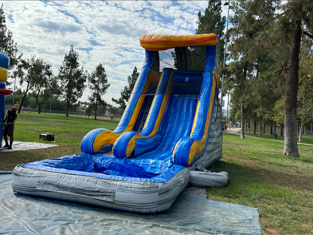 A large inflatable water slide is sitting in the middle of a park.