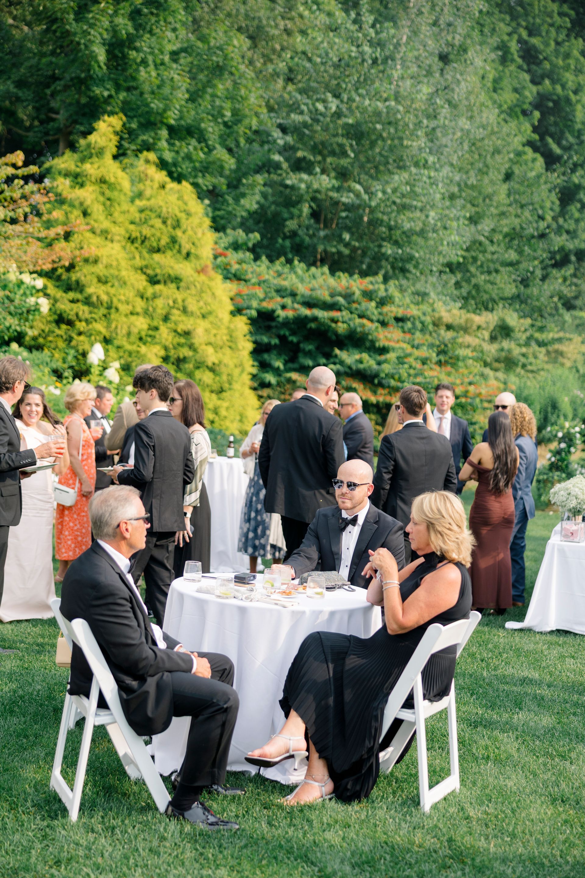 A group of women are taking a selfie at a wedding reception.