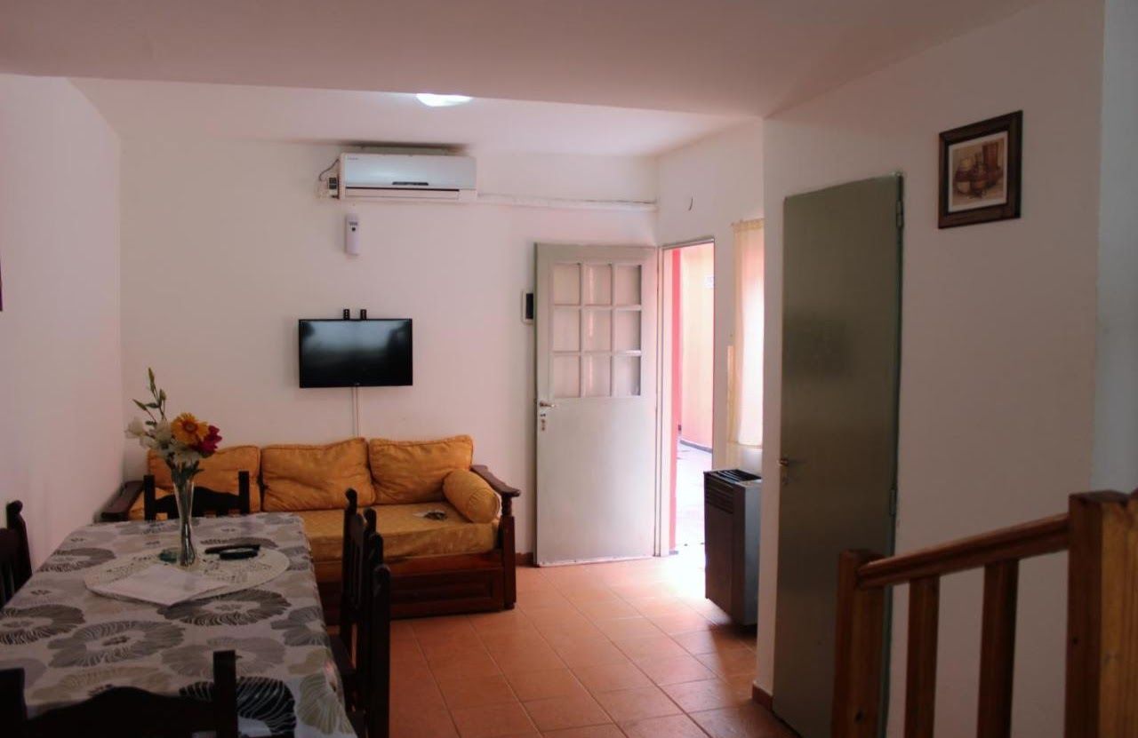 A living room with a couch a table and a television