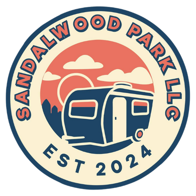 A logo for sandalwood park llc with a trailer in the middle