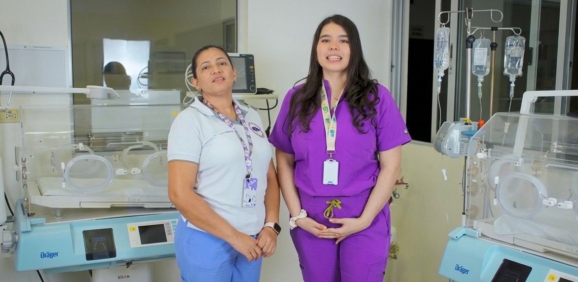 Hyundai truck with water jugs, driving on a dirt road, trees in the background.